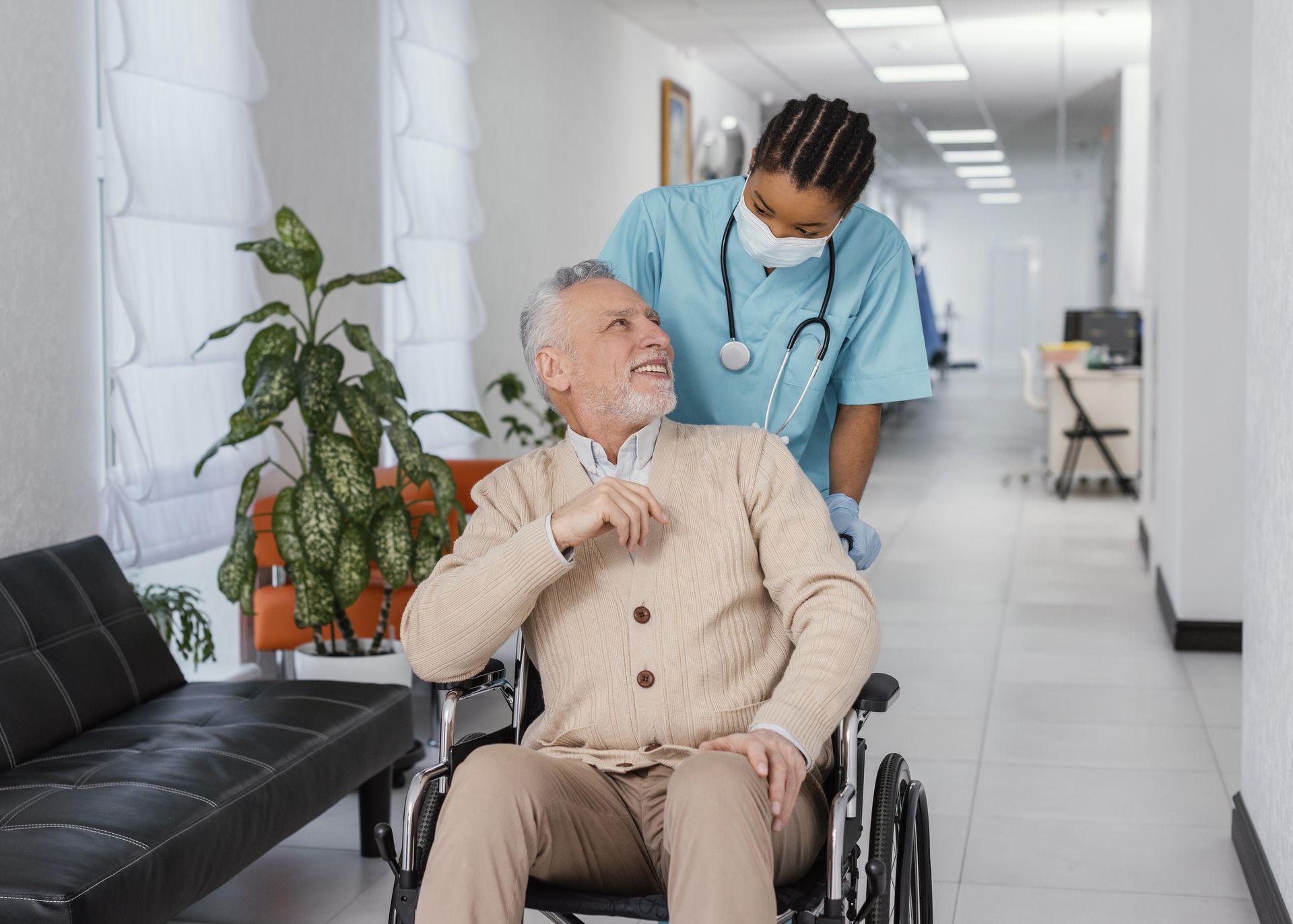 Learn more about our caregivers' offer Caregivere hlping old man in mobility .